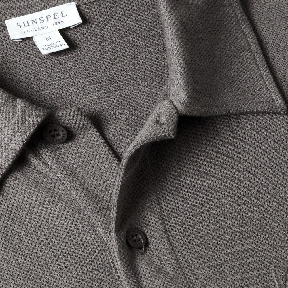 Close-up of the polo collar highlighting the structured collar and button placket detail.