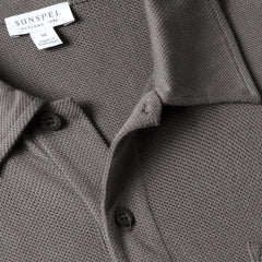 Close-up of the polo collar highlighting the structured collar and button placket detail.