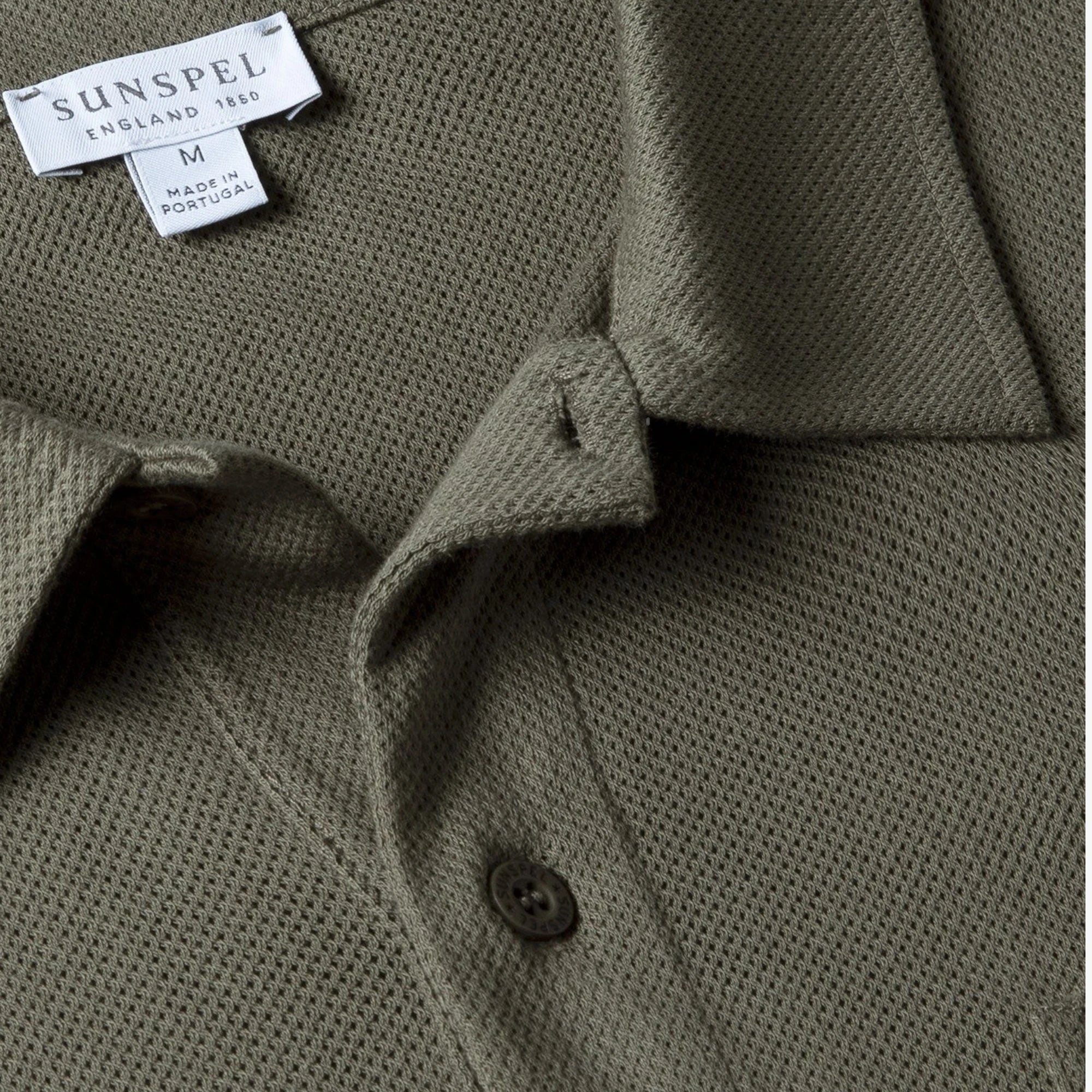 Close-up of the polo collar highlighting the structured collar and button placket detail.