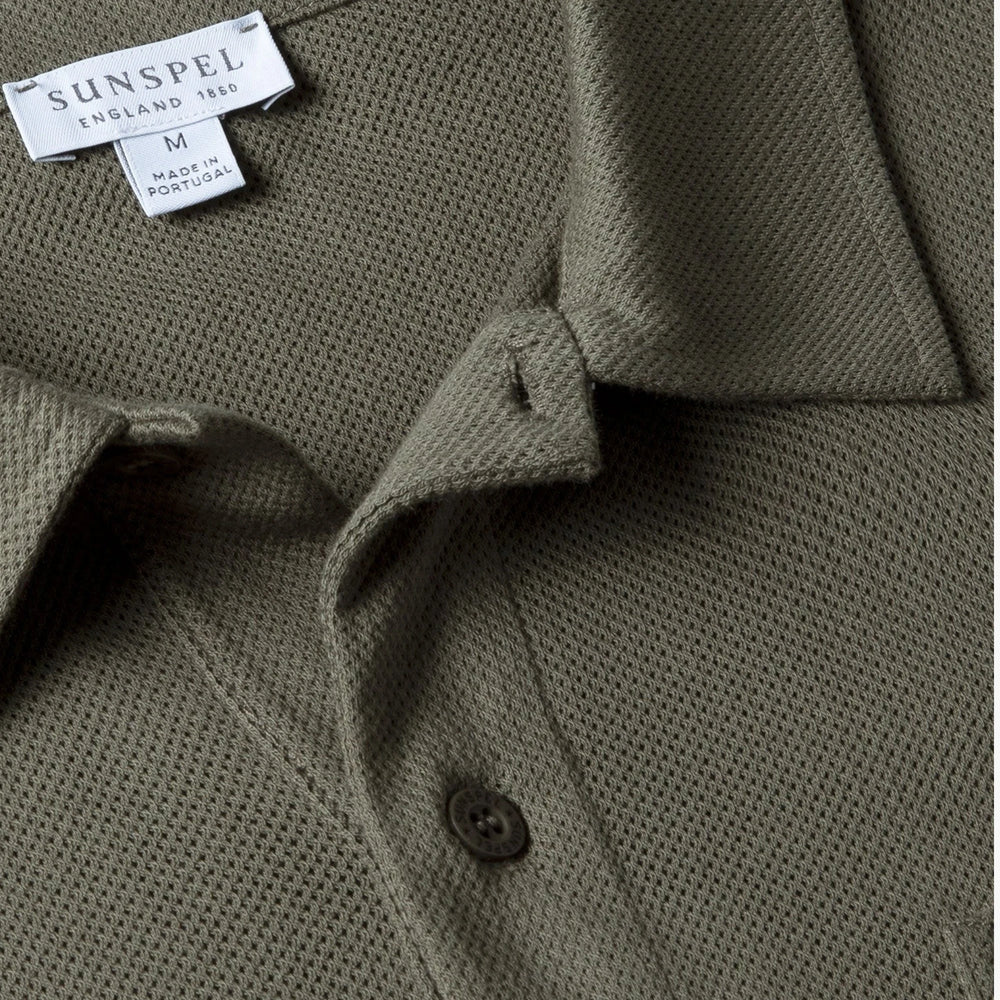 Close-up of the polo collar highlighting the structured collar and button placket detail.