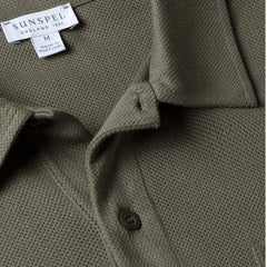 Close-up of the polo collar highlighting the structured collar and button placket detail.