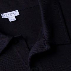 Close-up of the collar of the Sunspel Riviera Polo Shirt Midnight Navy showing the breathable mesh cotton and refined neckline.