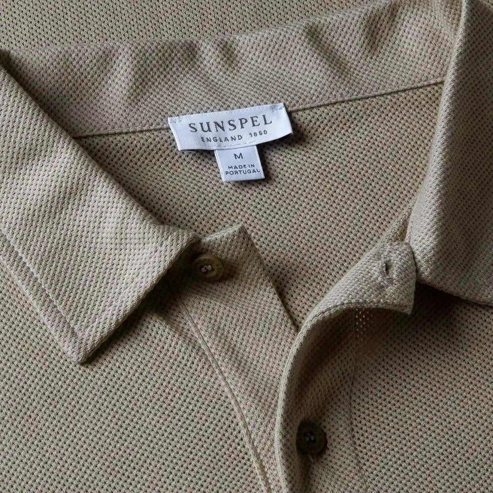 Close-up of the polo collar highlighting the structured collar and button placket detail.