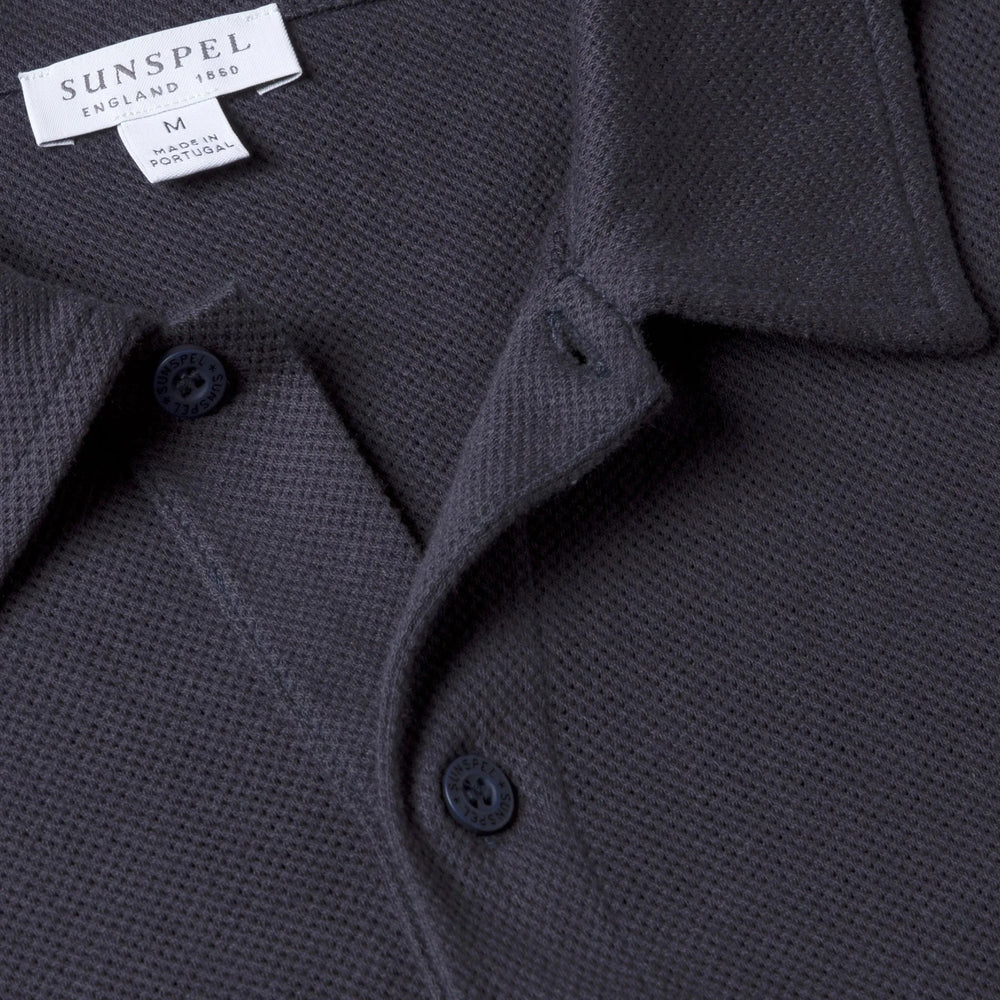 Close-up of the polo collar highlighting the structured collar and button placket detail.