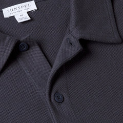 Close-up of the polo collar highlighting the structured collar and button placket detail.