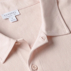 Close-up of the collar of the Sunspel Riviera Polo Shirt Pastel Pink showing the breathable mesh cotton and refined neckline.