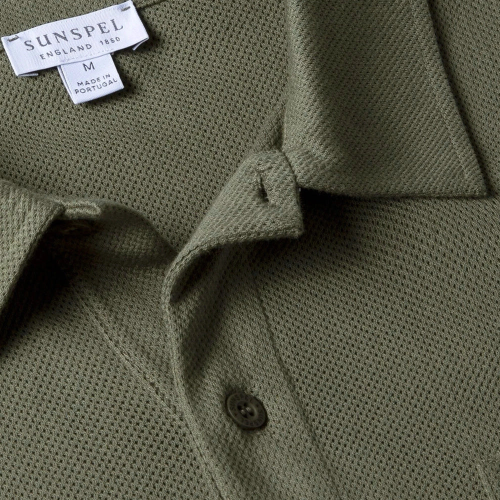Close-up of the polo collar highlighting the structured collar and button placket detail.