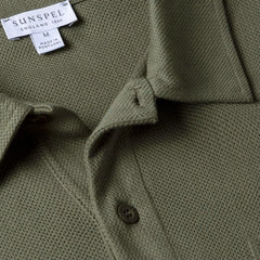 Close-up of the polo collar highlighting the structured collar and button placket detail.