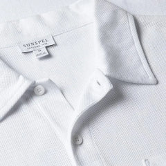 Close-up of the collar of the Sunspel Riviera Polo Shirt Undyed showing the natural cotton mesh texture and refined neckline.