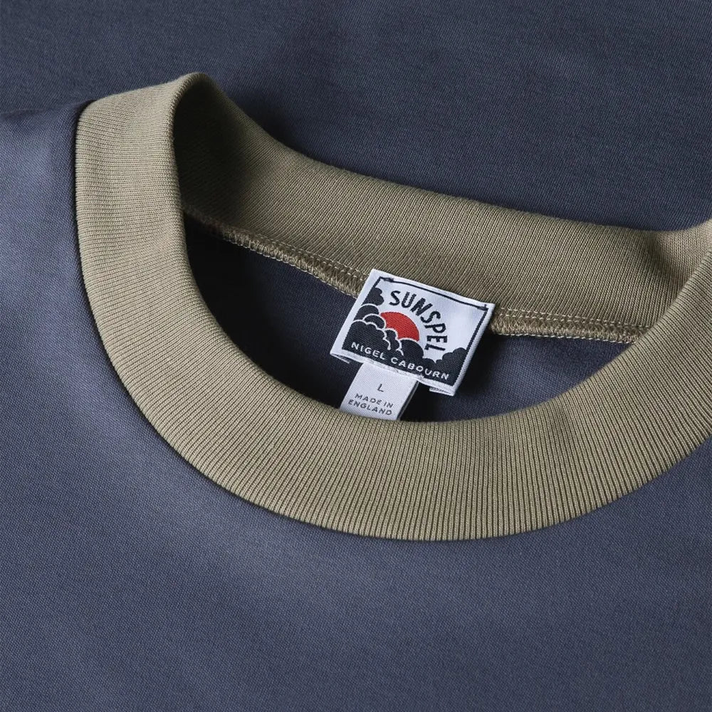Close-up of the collar of the Sunspel x Nigel Cabourn Carbon Brushed T-shirt Slate Blue showing the brushed cotton texture and refined neckline.