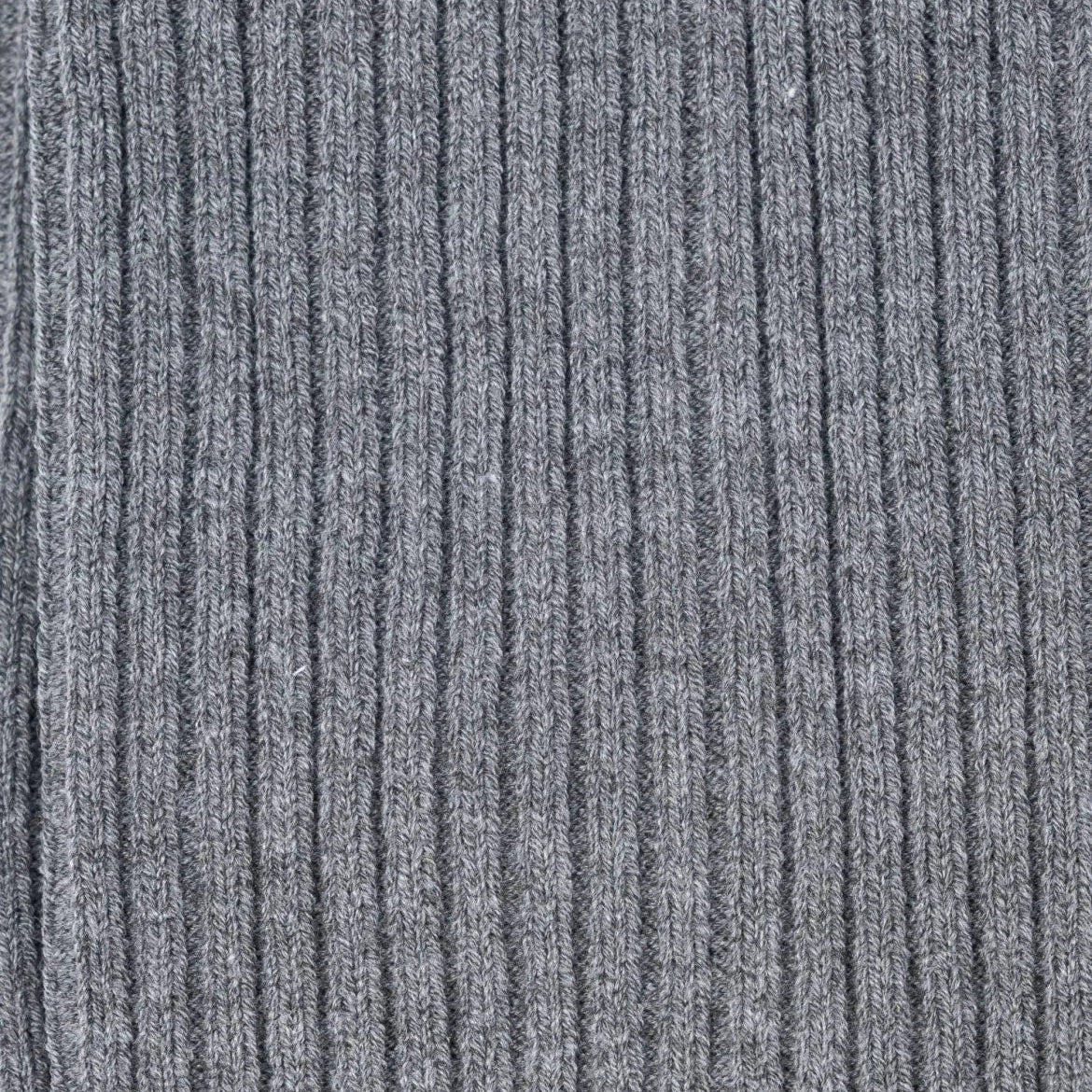 Close-up of the grey ribbed knit texture on Tabio Power Rib Long Calf Socks