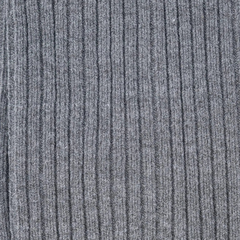 Close-up of the grey ribbed knit texture on Tabio Power Rib Long Calf Socks