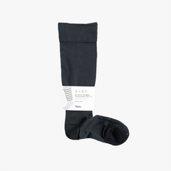 Full view of the Tabio Utility Light Comp. Pile High Socks in Matte Black showing the high-crew silhouette and performance-inspired rib structure.