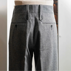 Rear view of the Tangent TAN02 Henry Hard Classic Tweed Herringbone Light Grey trousers featuring the back pockets and structured fit.