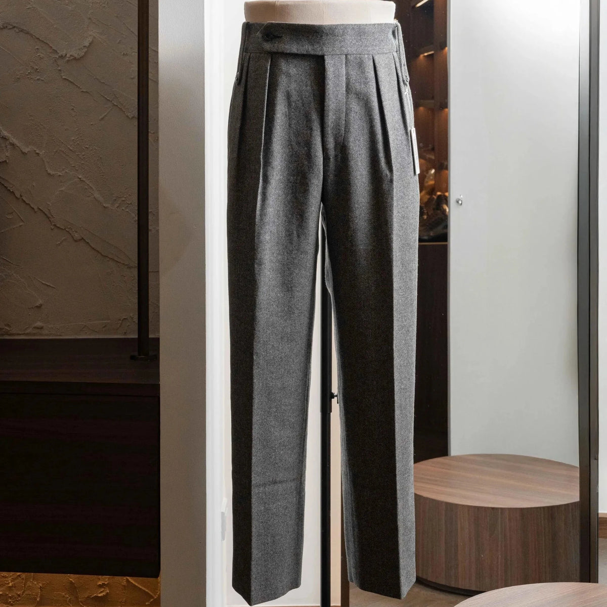 Full-length view of the Tangent TAN02 Henry Hard Classic Tweed Herringbone Light Grey trousers, showing the tailored silhouette and herringbone pattern.