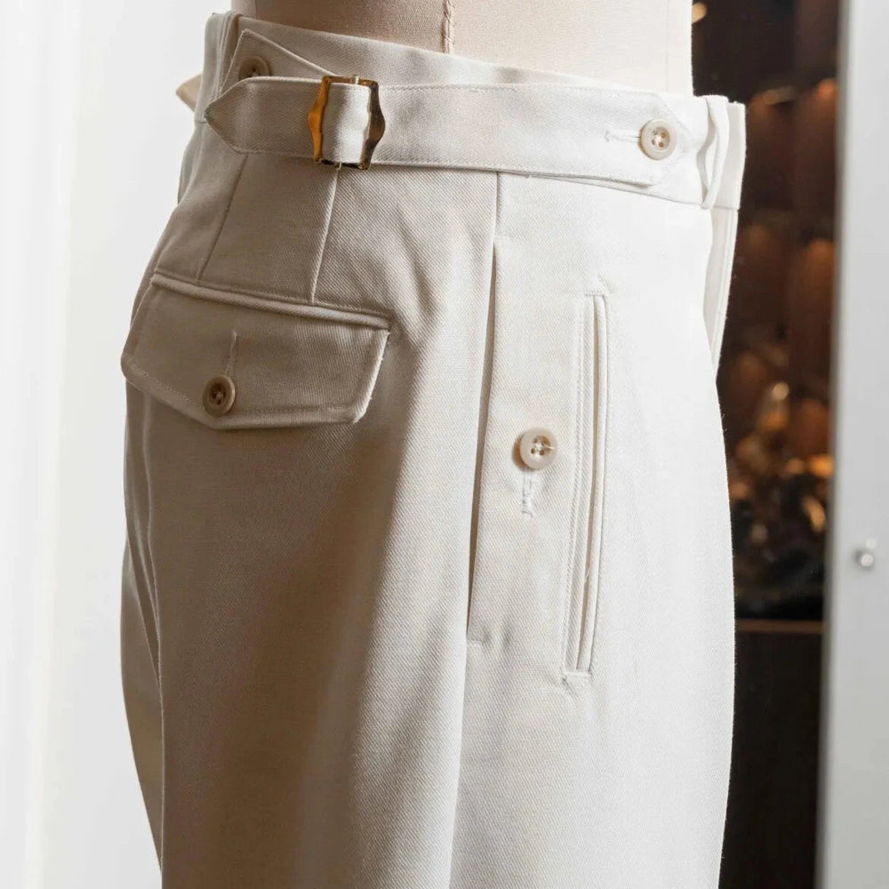 Side profile of the Tangent Tan 04° Charles Hard Twist Twill Off White trousers highlighting the structured twill fabric and side adjusters