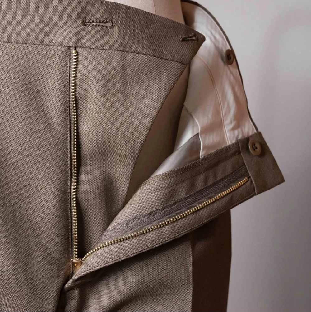 Close-up of the zipper area of the Tangent TAN24 Pepe Khaki trousers, showing the fly construction, stitching, and hardware details.