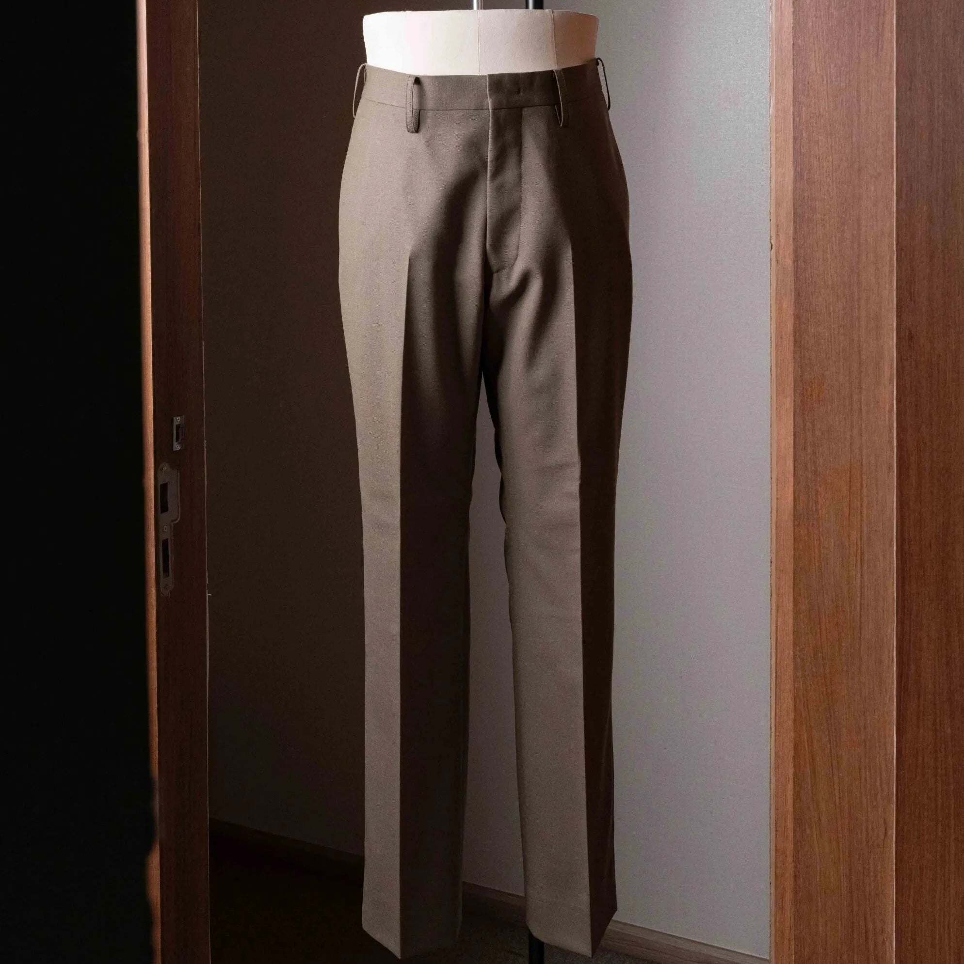 Full-length view of the Tangent TAN24 Pepe Khaki trousers, showing the relaxed tailored silhouette.
