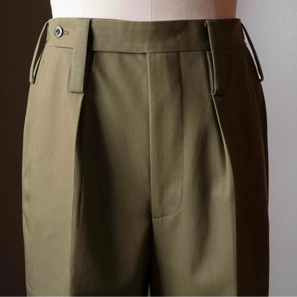 Side profile of the Tangent TAN25 Pat Olive trousers highlighting the clean lines and refined construction.