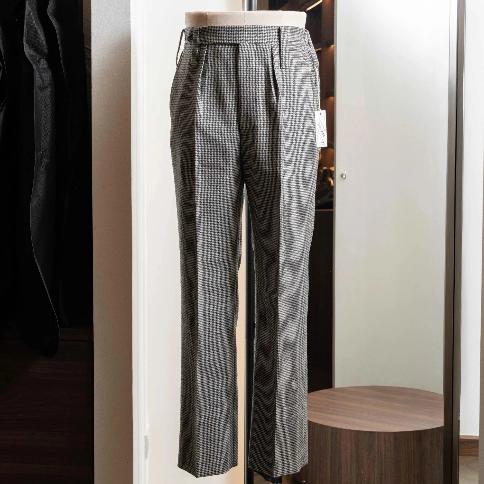 Full-length view of the Tangent Tan 25° Wool Check Hound Tooth trousers, showing the tailored silhouette and houndstooth pattern.