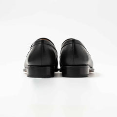 Rear view of TLB Mallorca 315 Jones Penny Loafer Black Box Calf showing heel and counter design