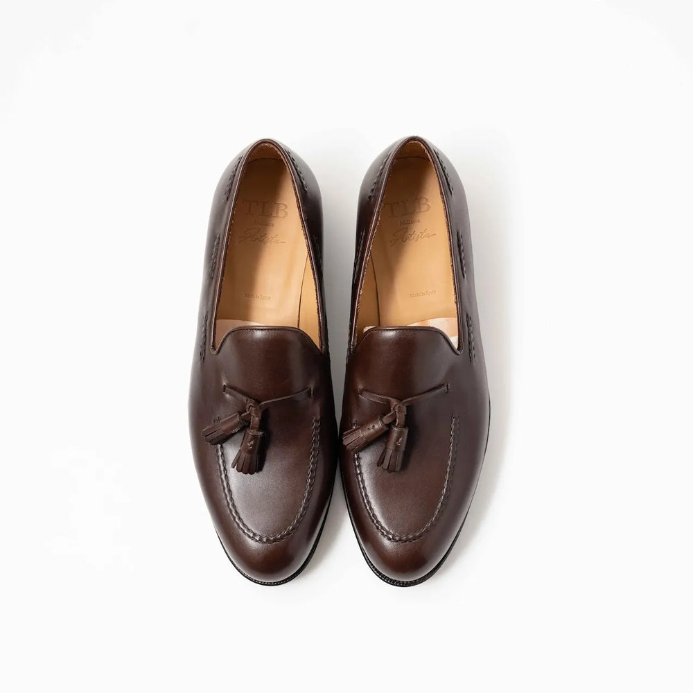 Top-down view showing the twin tassels, apron stitching, and smooth patina of the TLB Mallorca 316 Jones Loafer.