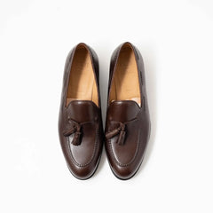 Top-down view showing the twin tassels, apron stitching, and smooth patina of the TLB Mallorca 316 Jones Loafer.
