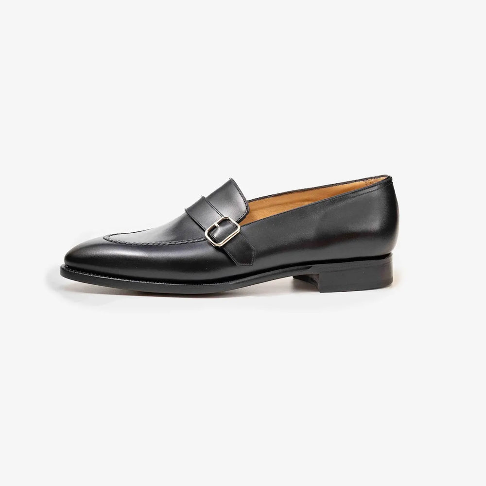Side profile of the TLB Mallorca Goya Buckled Loafer in smooth black box calf leather with single leather sole.