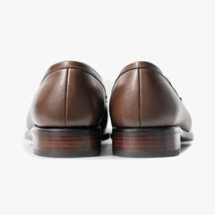 Close-up of the leather sole showing clean edge finishing and solid construction.
